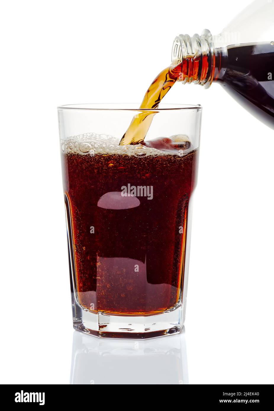 Pouring cola drink to glass on white background Stock Photo