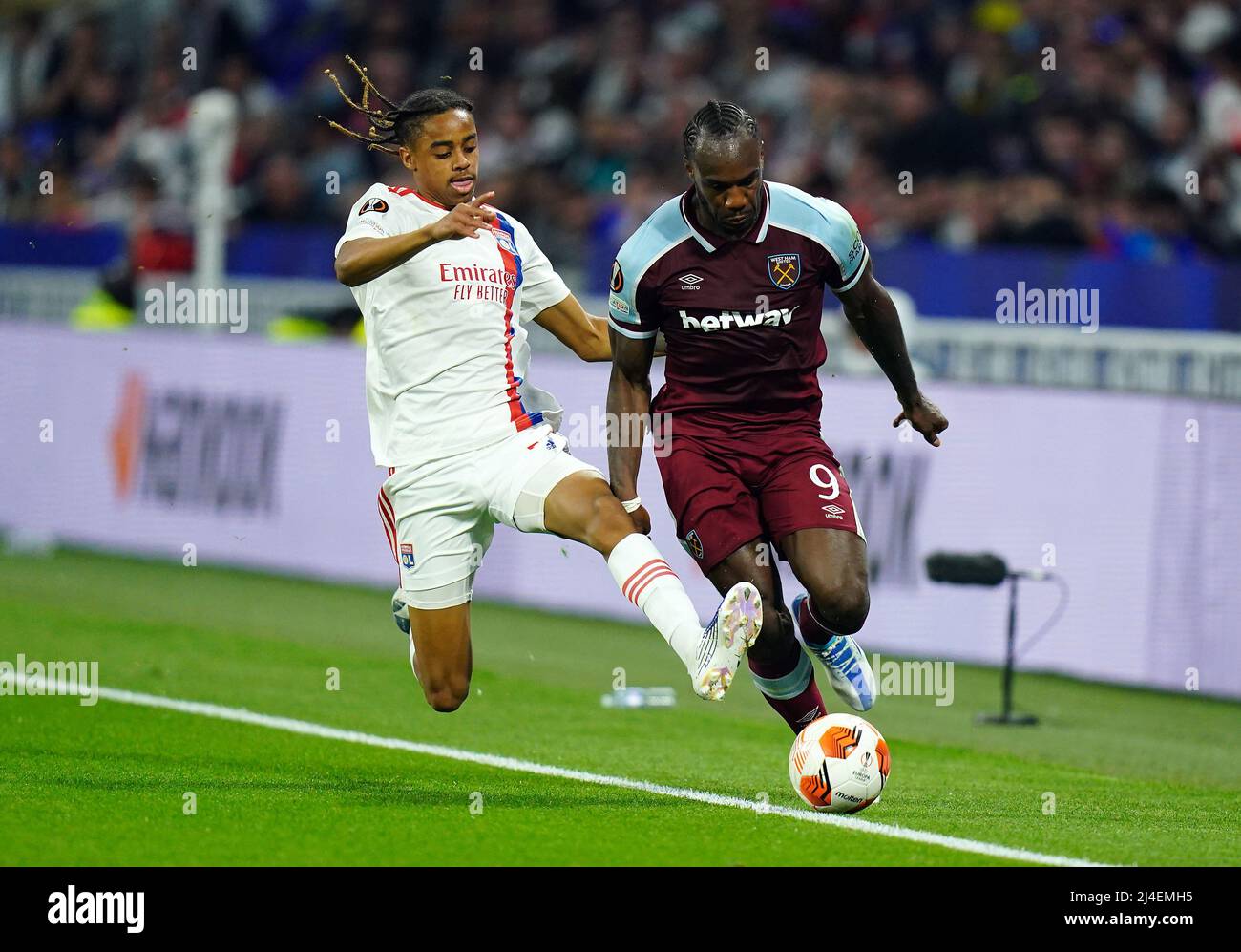 Lyon's Bradley Barcola (left) challenges West Ham United's Michail Antonio  during the UEFA Europa League quarter