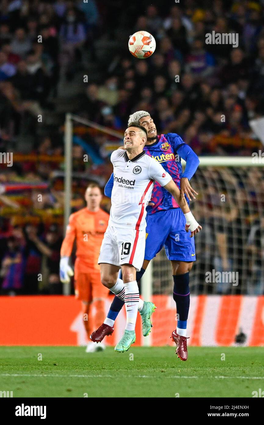 Rafael Borre of Eintracht Frankfurt in action with Araujo of FC Barcelona during the UEFA Europa League Quarter Final Leg Two match between FC Barcelona and Eintracht Frankfurt at Camp Nou in Barcelona Stock Photo