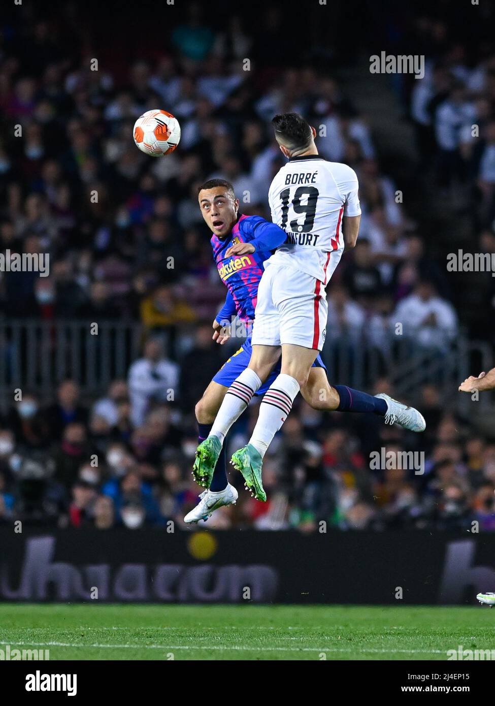 Serginho Dest of FC Barcelona in action with Rafael Borre of Eintracht Frankfurt during the UEFA Europa League Quarter Final Leg Two match between FC Barcelona and Eintracht Frankfurt at Camp Nou in Barcelona Stock Photo