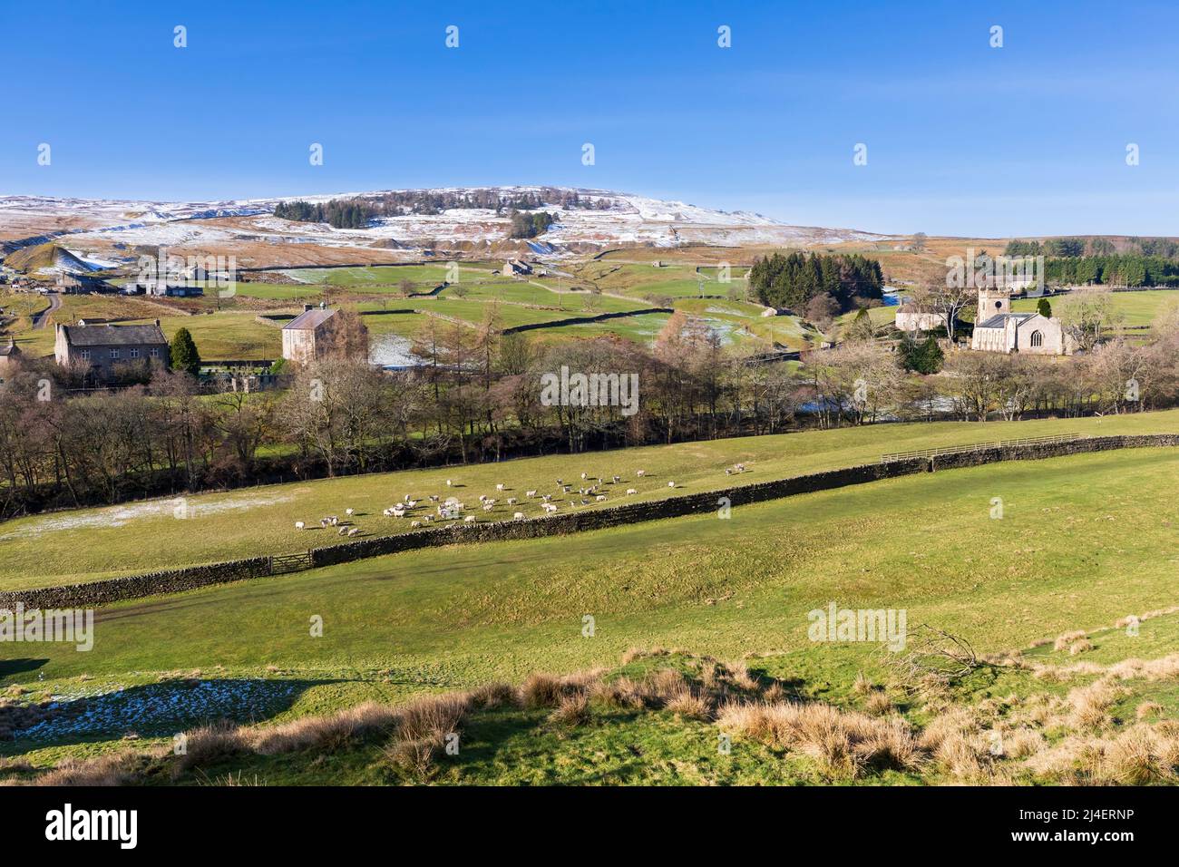 Langthwaite, Arkengarthdale, Yorkshire Dales National Park. Snow covers the hilltops in late February. Stock Photo