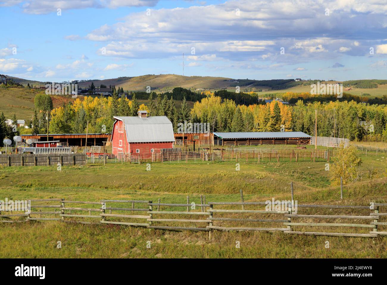 A rural Canadian landscape of farmland and a red barn in Alberta, Canada. Stock Photo