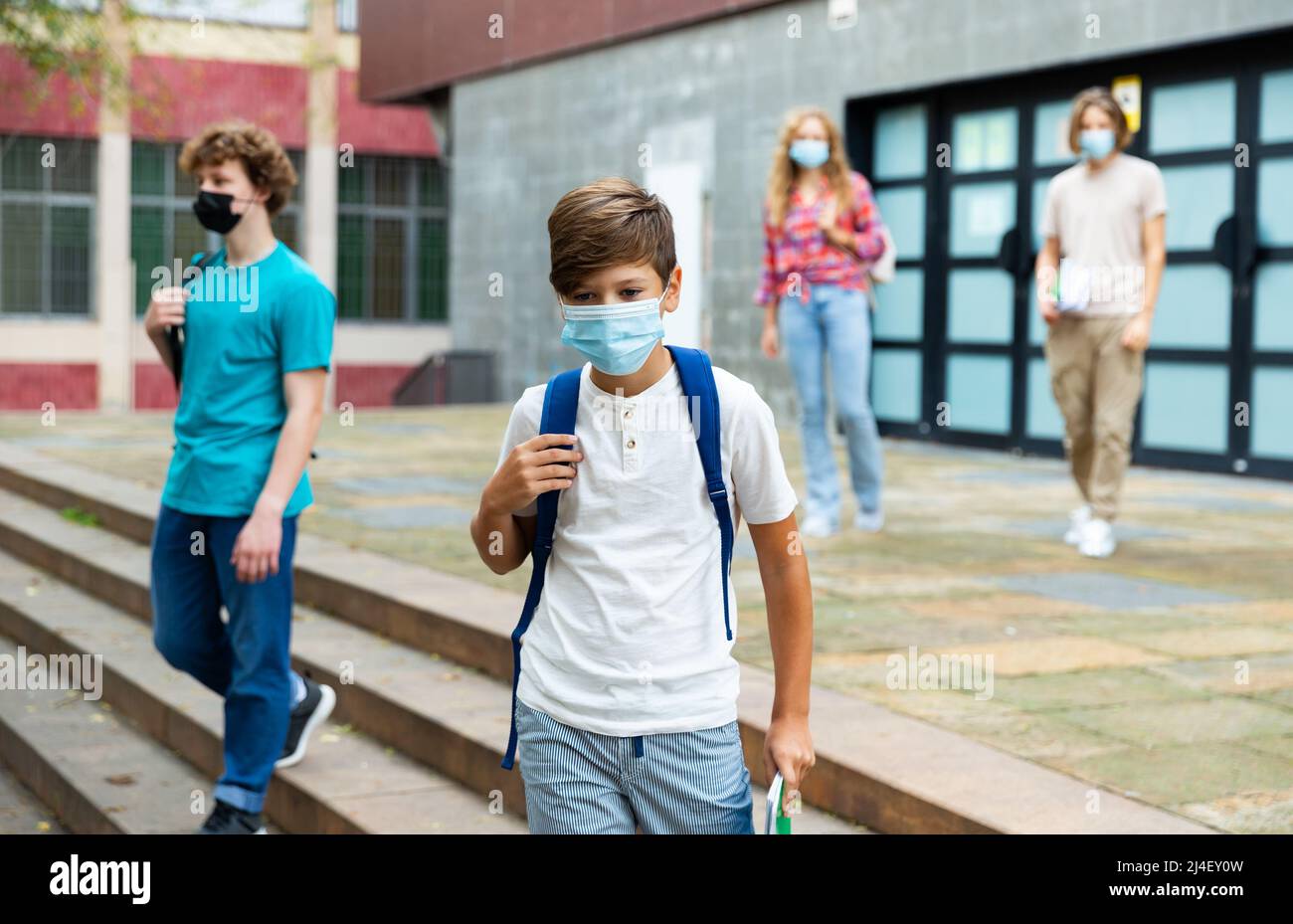 Young boy in mask going home from school Stock Photo Alamy