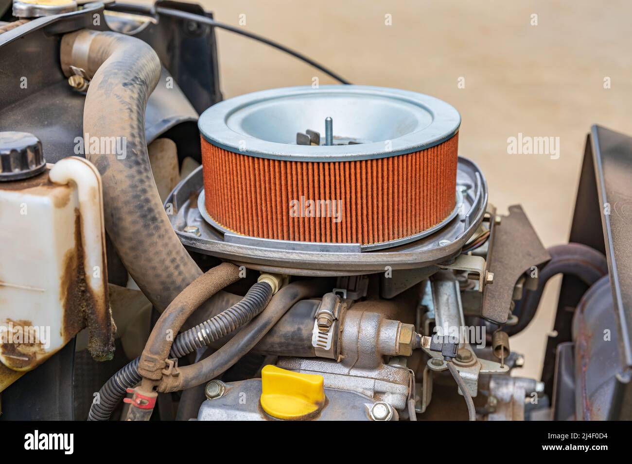 Air filter on lawn mower tractor. Small engine repair, maintenance and tune up concept Stock Photo