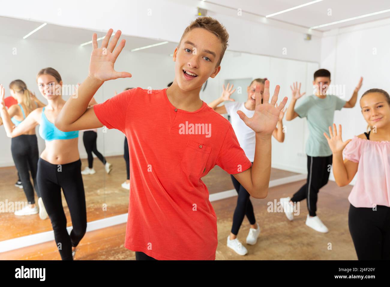 Teenage boy practicing dance with group Stock Photo - Alamy