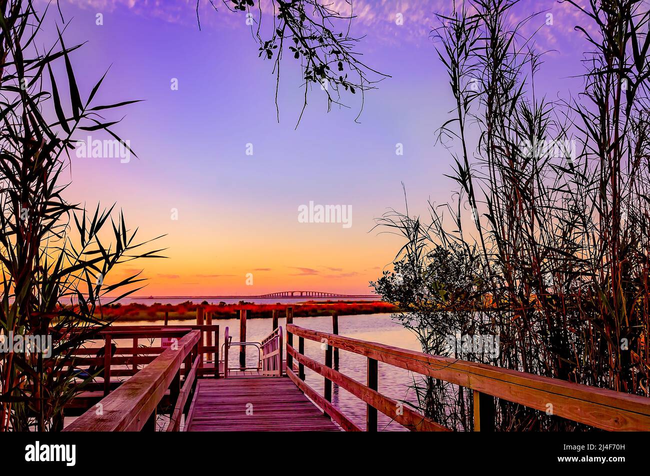 The Dauphin Island Bridge is pictured at sunset from Blue Heron Park