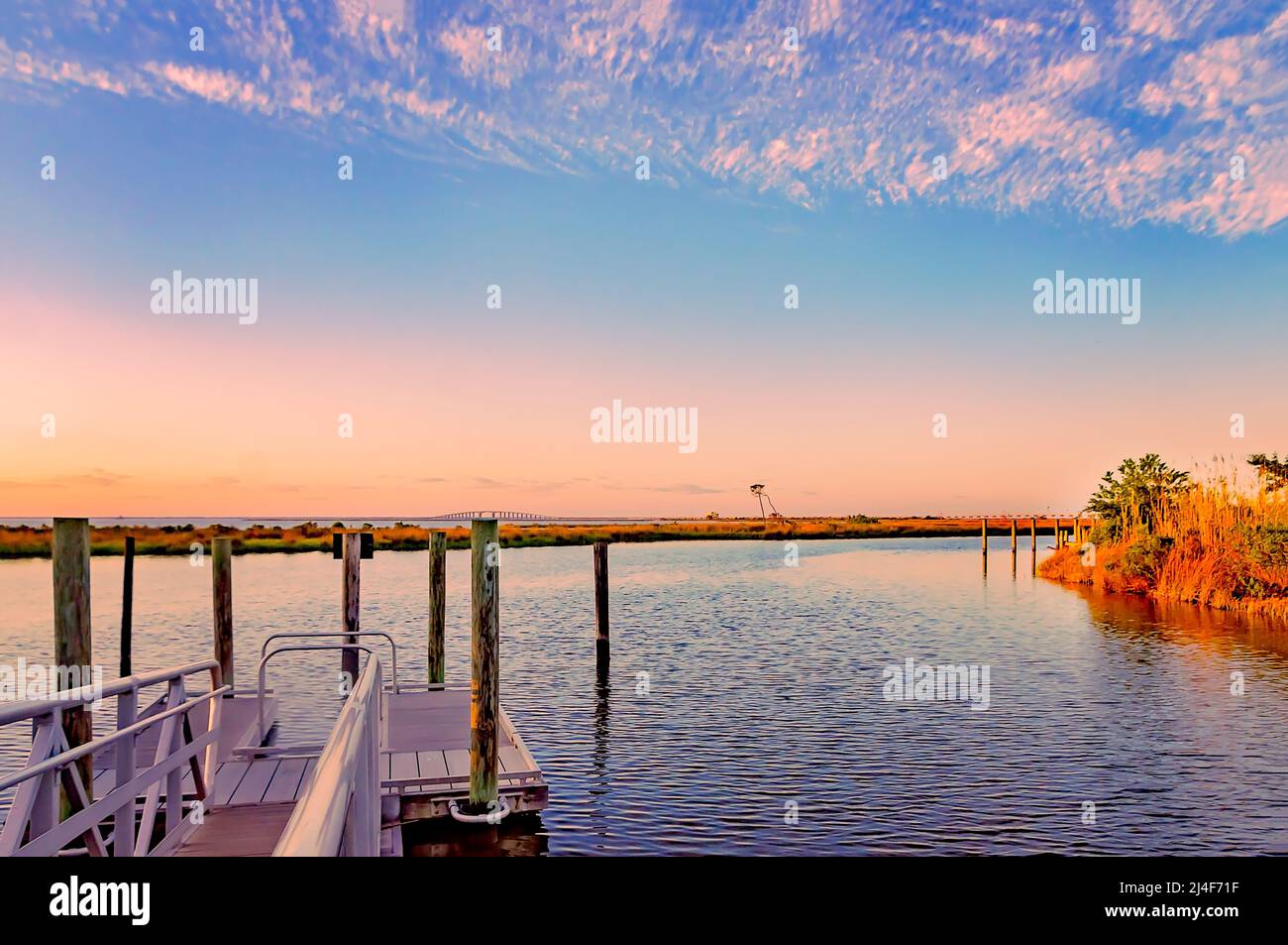 The Dauphin Island Bridge is pictured at sunset from Blue Heron Park