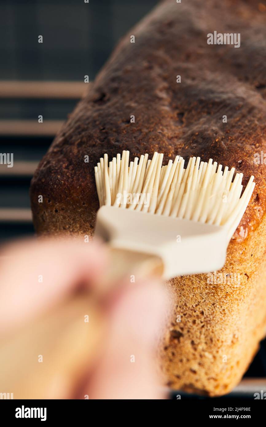 The process of making rye molded bread. Coating the finished bread with starch jelly. Vertical
