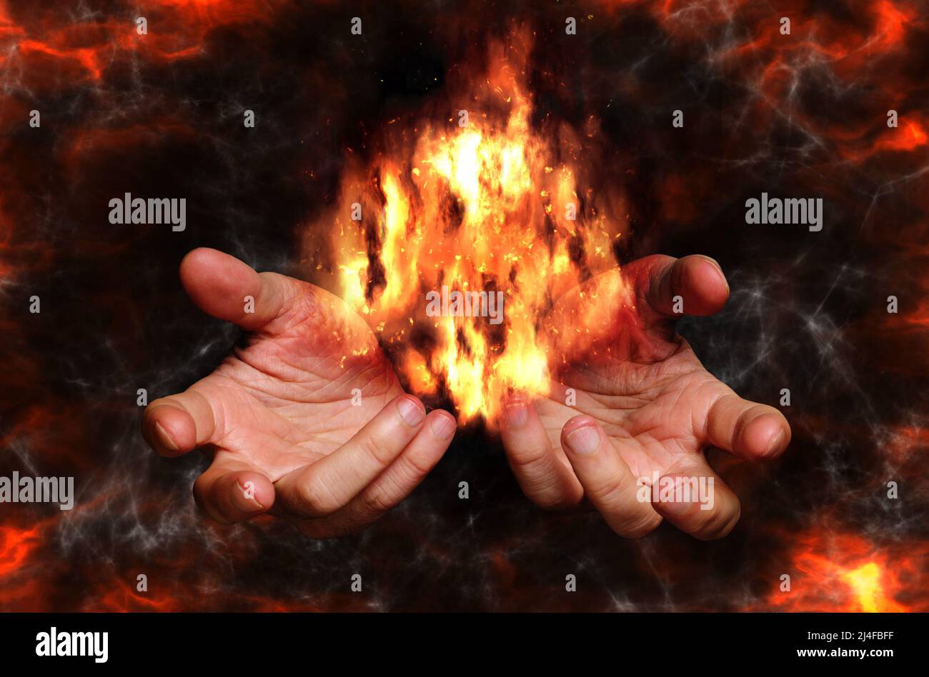 man hands holding fire Stock Photo