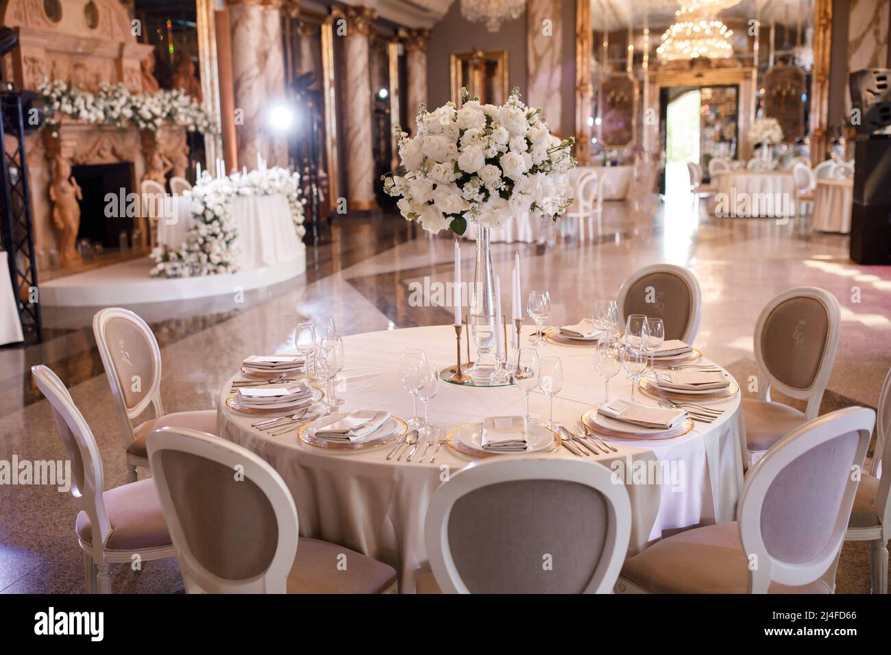 Tables setting at a luxury wedding. Table for guests. Dishes and drinks