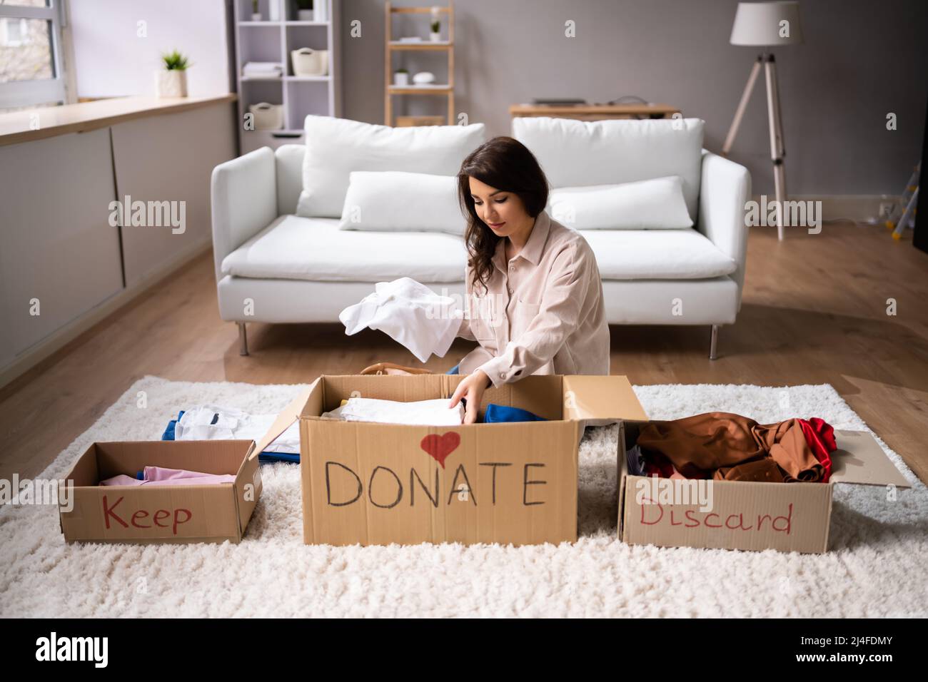 Donating Decluttering And Cleaning Up Wardrobe Clothes Stock Photo