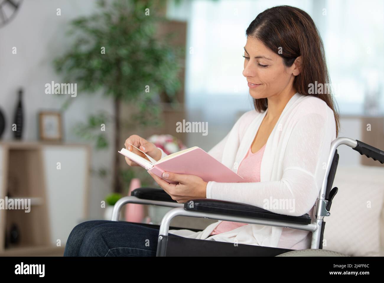 smiling young woman in wheelchair Stock Photo - Alamy