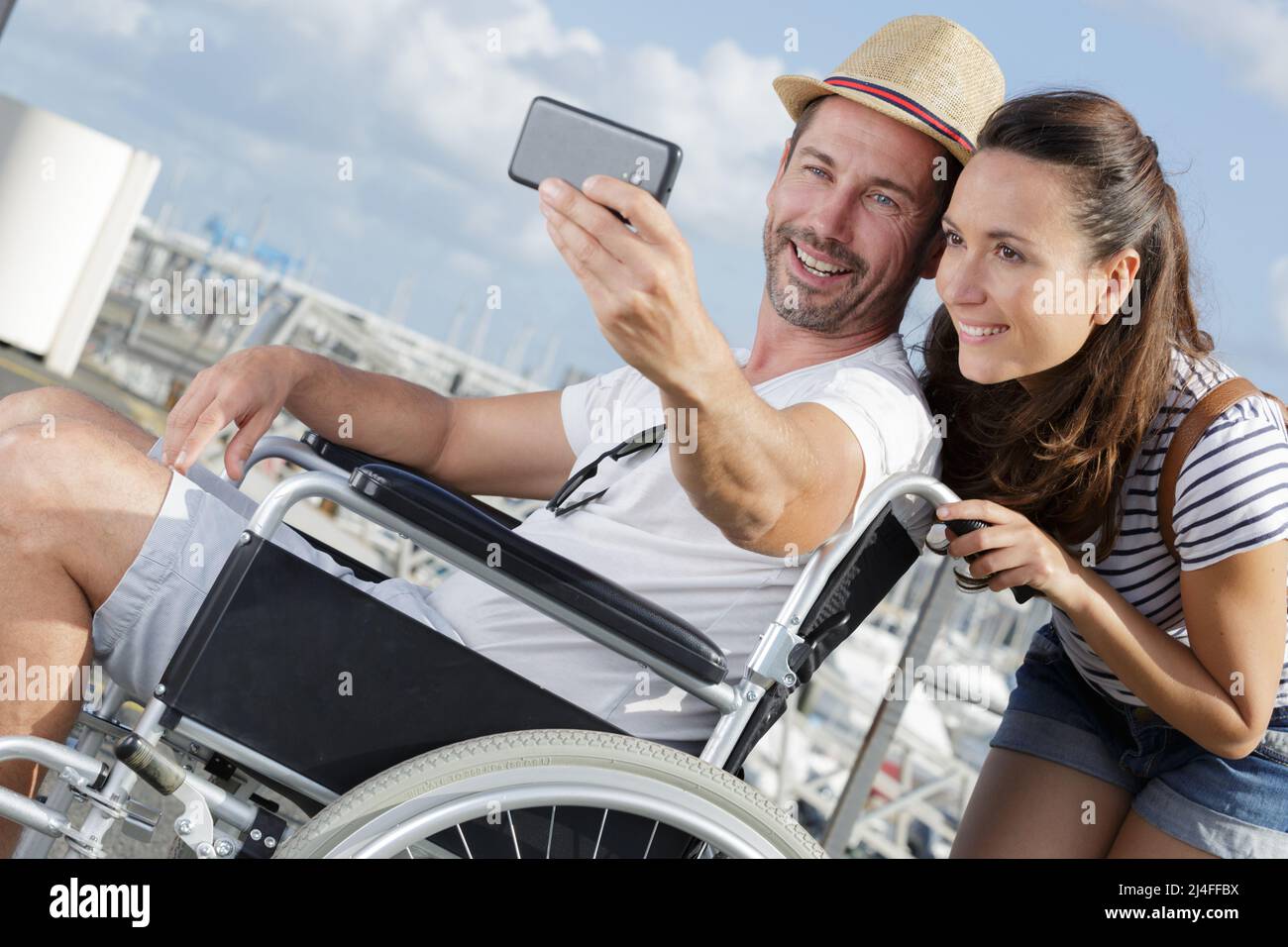 attractive couple talking selfie man in wheelchair Stock Photo - Alamy