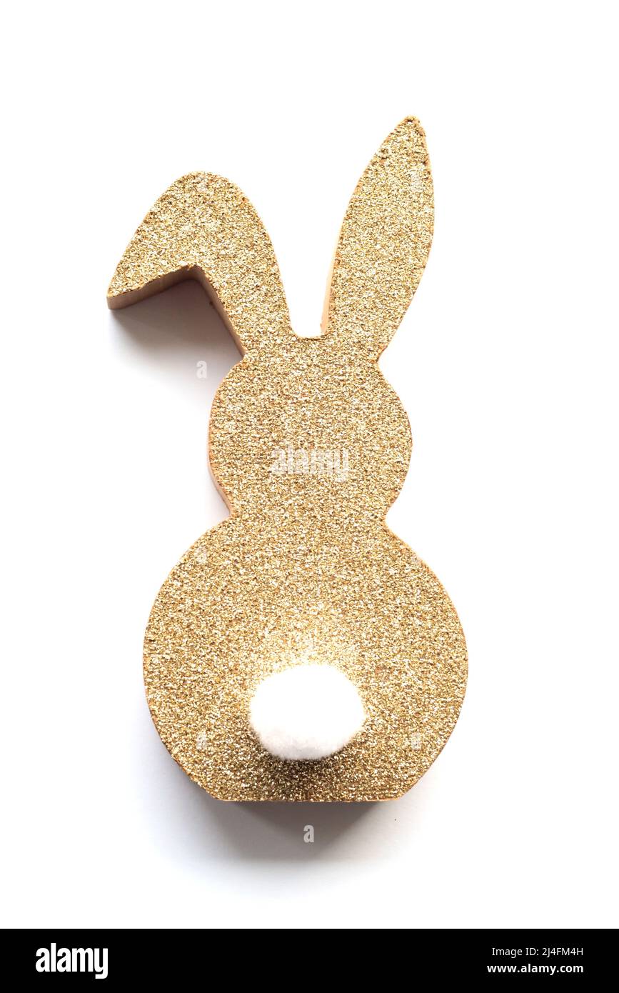 Cute Easter golden bunny on a white background. Happy Easter minimal concept. soft selective focus. Stock Photo