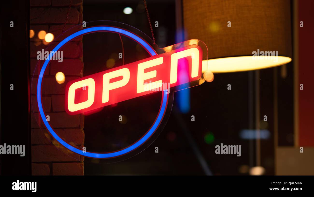Neon glowing sign open Stock Photo