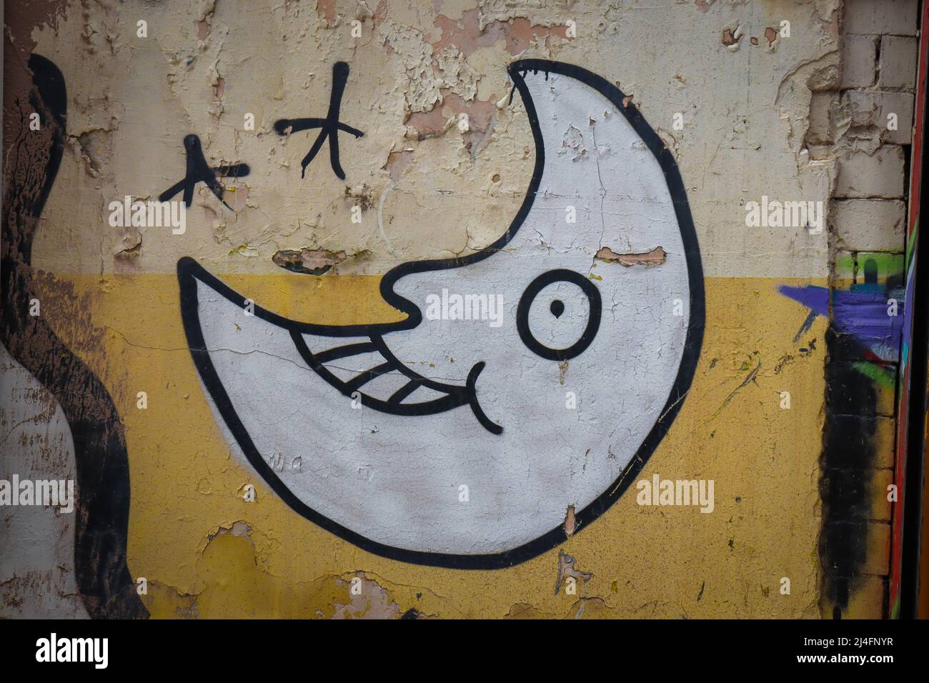 Smiling face crescent moon, street art Stock Photo