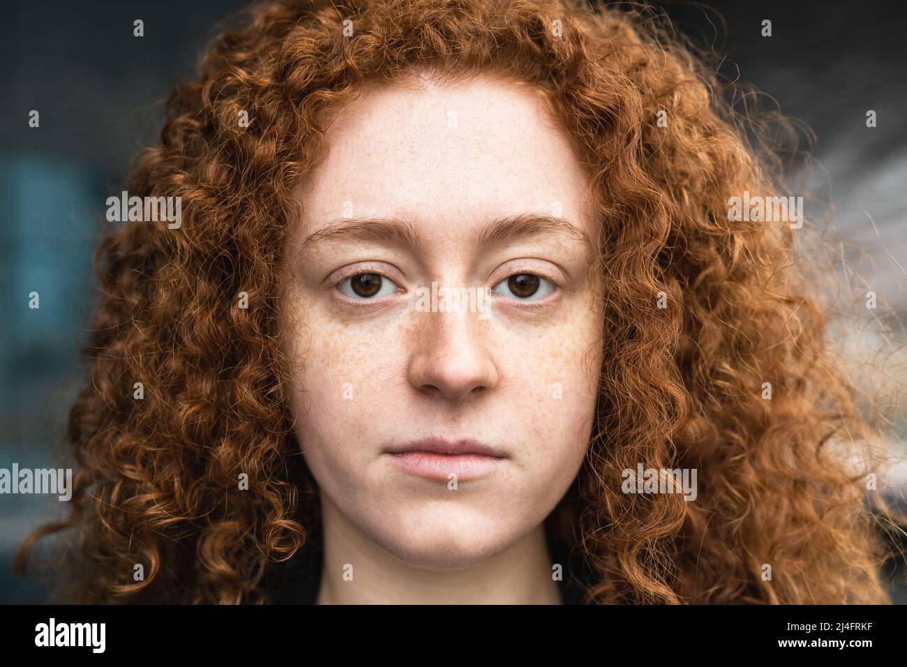 Closeup portrait of redhead girl looking at camera Stock Photo