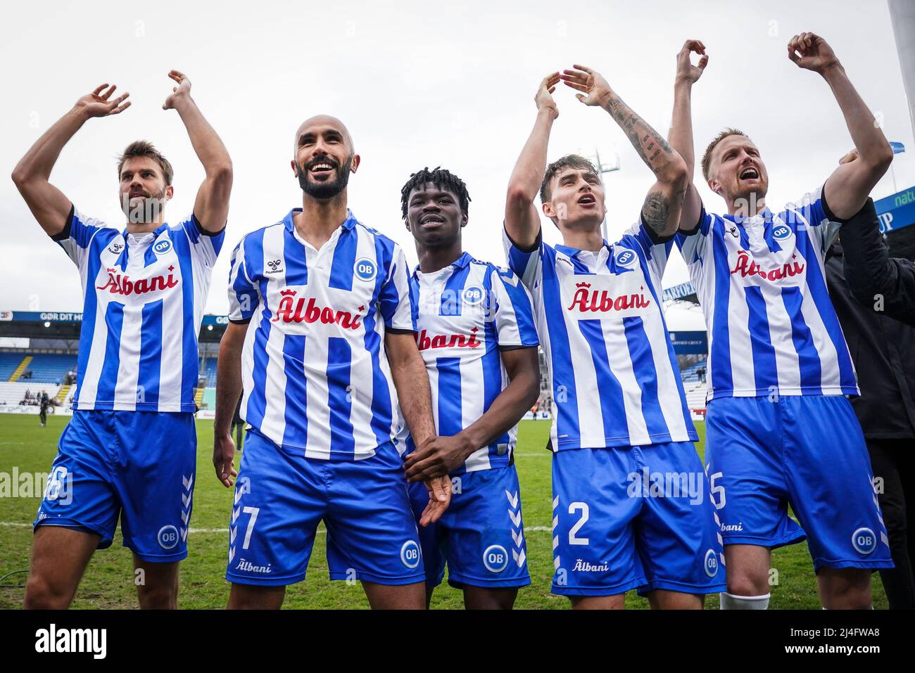 Odense, Denmark. 14th Apr, 2022. The players of OB celebrate with the fans  after the 3F Superliga match between Odense Boldklub and Vejle Boldklub at  Nature Energy Park in Odense. (Photo Credit:
