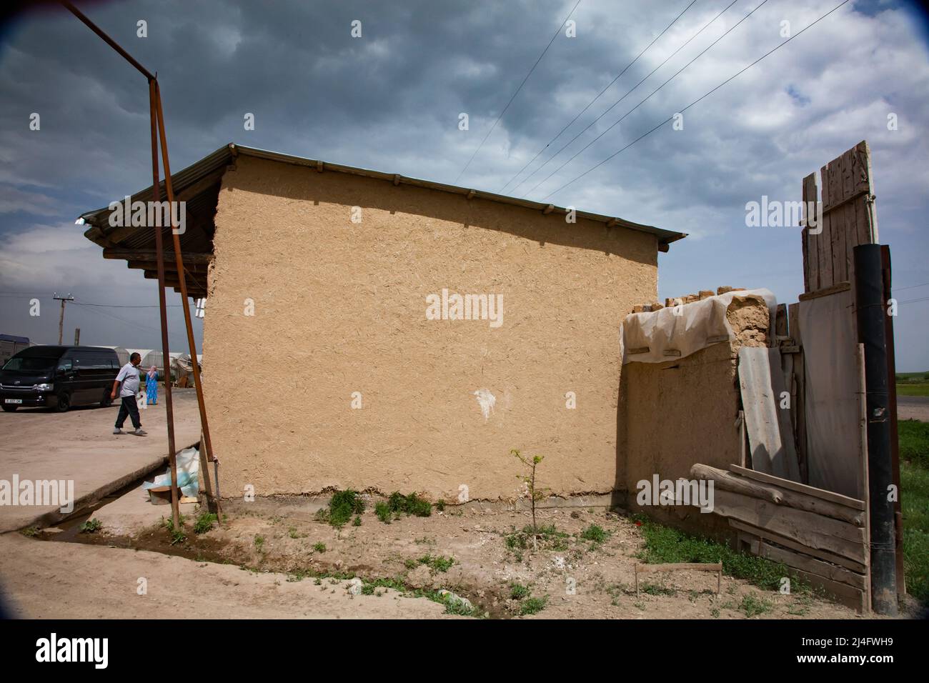 South Kazakhstan - April 28,2012: Traditional asian house in village built from adobe bricks. Bricks made from mix clay and straw. Stock Photo