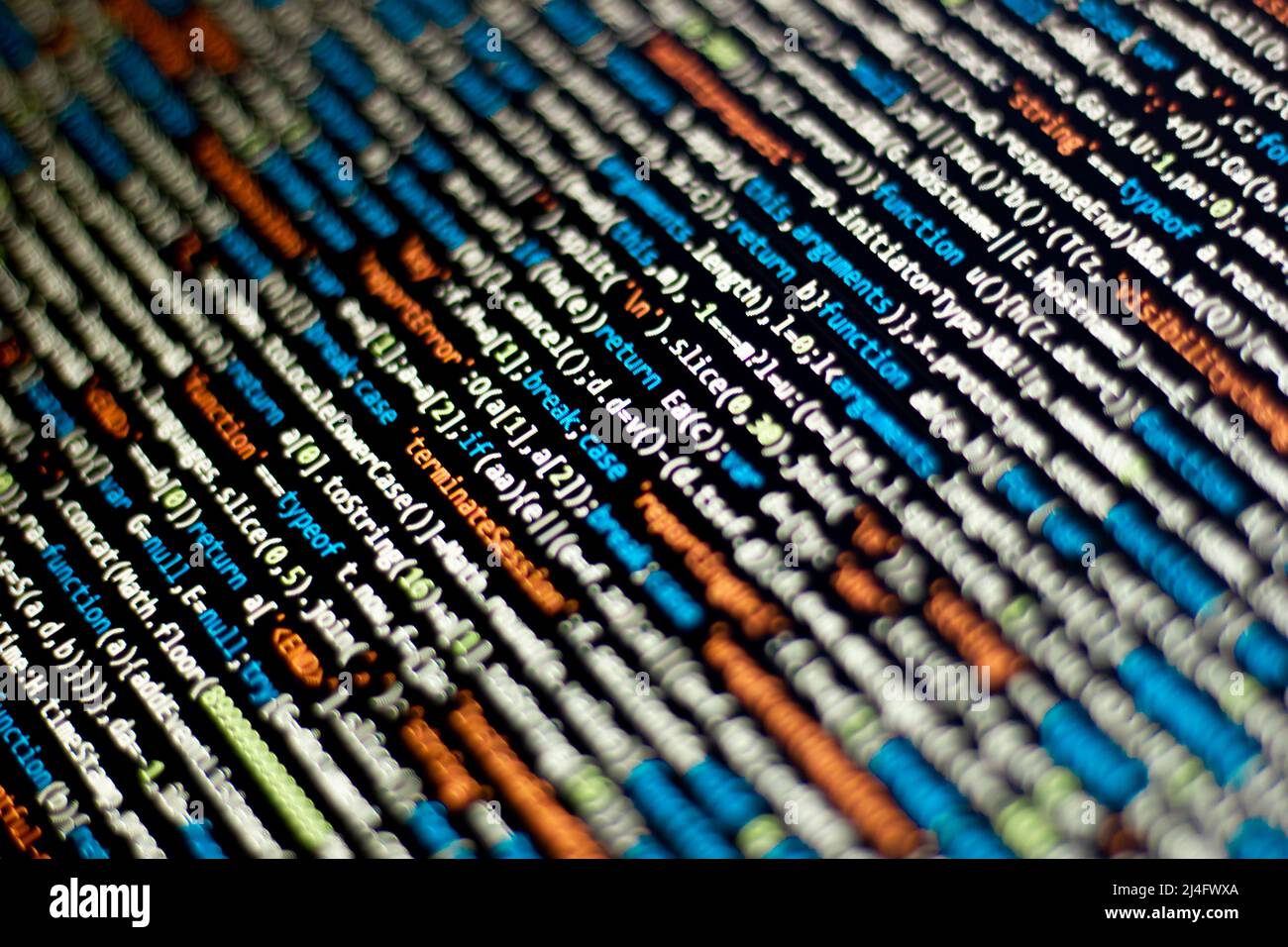 The software developer does the coding. Abstract code screen for use as a background. The programmer does web coding. Selective focus Stock Photo