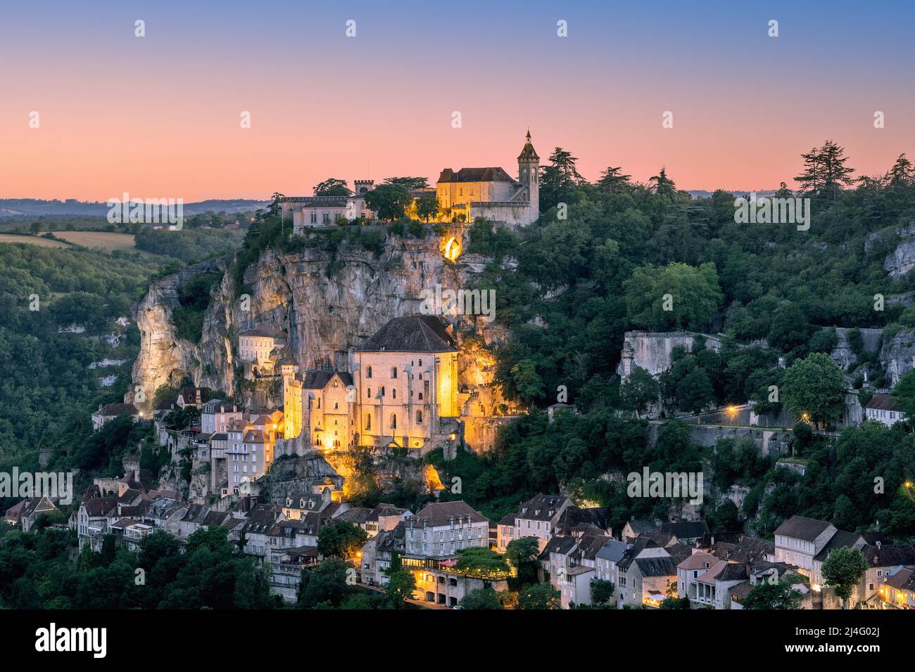Majestic religious buildings of Rocamadour settlement lit with warm