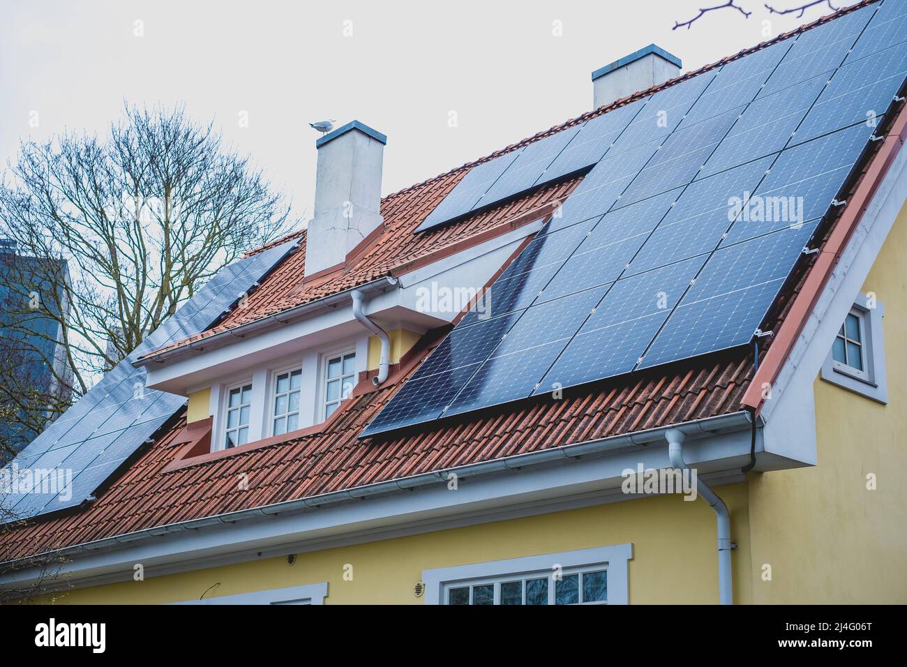 Closeup of solar panels installed on historic building gable roof with