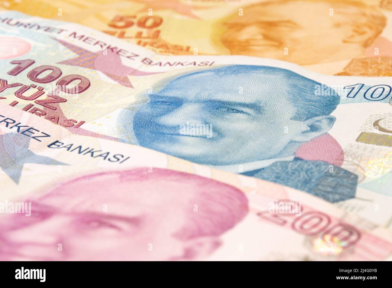 50, 100 and 200 Turkish Lira banknotes with Atatürk's portrait on them. Atatürk portrait on 100 Turkish Lira in selective focus. Business, finance. Stock Photo