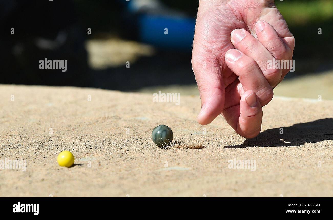 Crawley , Sussex UK 15th April 2022 - Action from  the World Marbles Championship held at The Greyhound pub in Tinsley Green , Crawley today . The championship is traditionally played every Good Friday and is back this year after a break due to Covid-19 : Credit Simon Dack / Alamy Live News Stock Photo