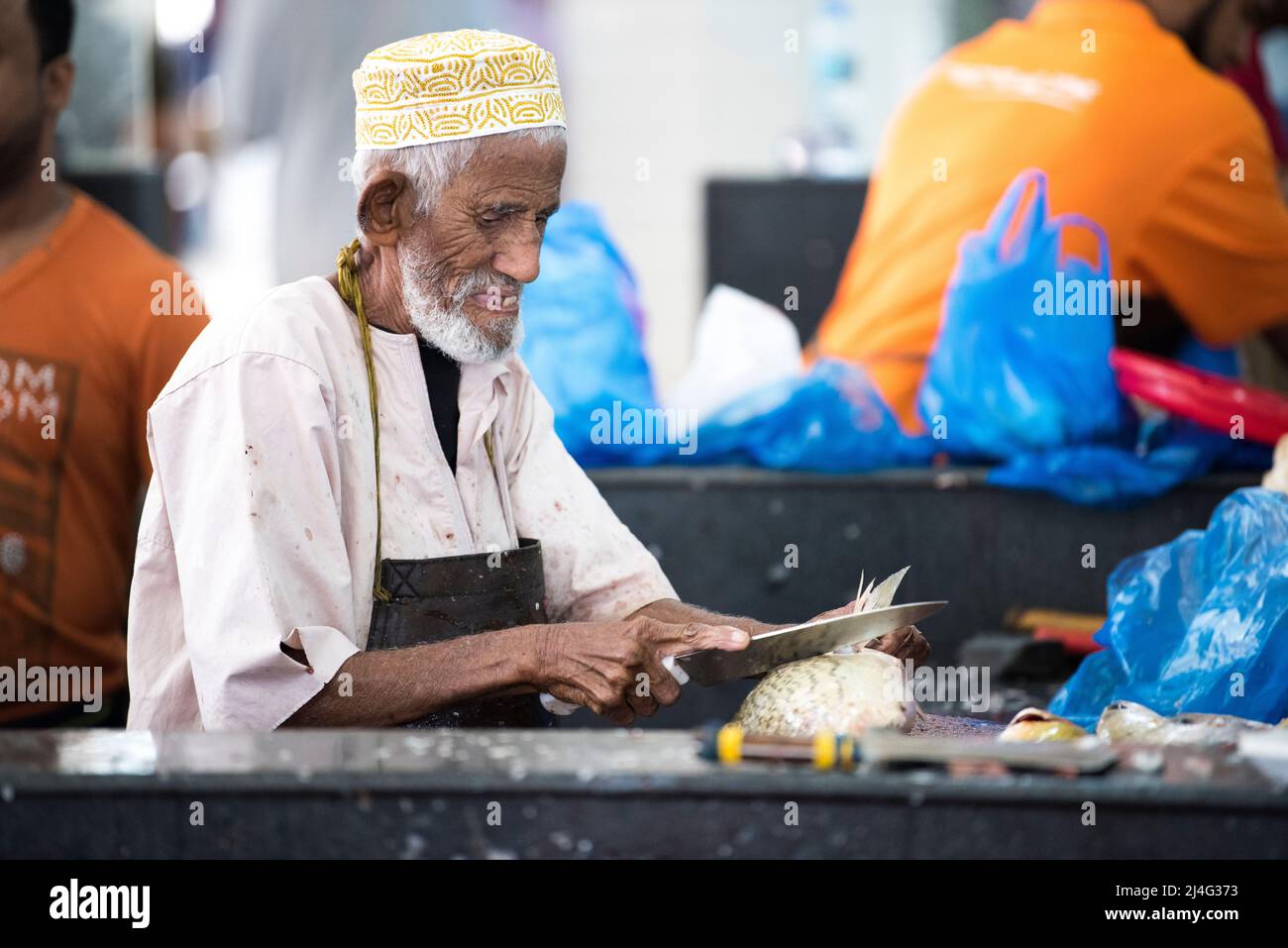 Muscat,Oman - April 20,2022: Workers of fish market in the old town Matrah. Stock Photo