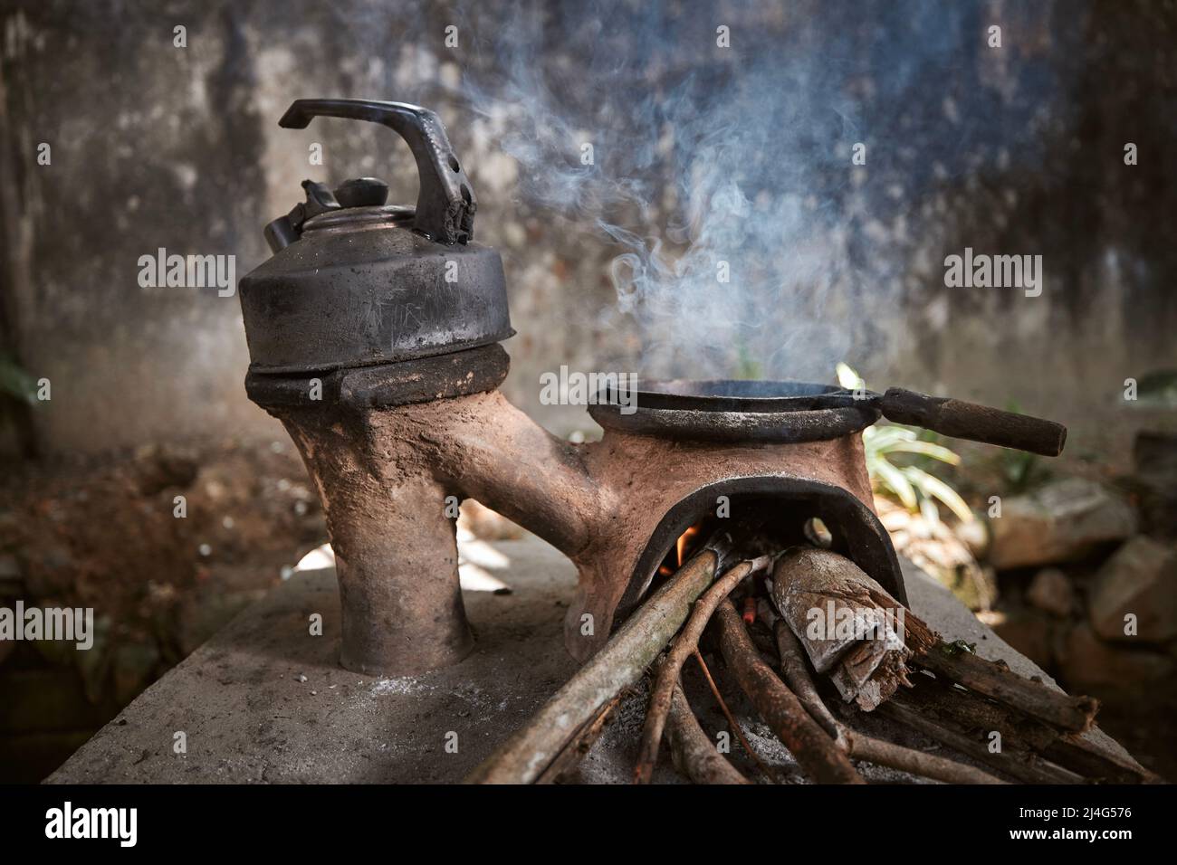 Preparing food on wood stove. Cooking in poor rural house in Sri Lanka
