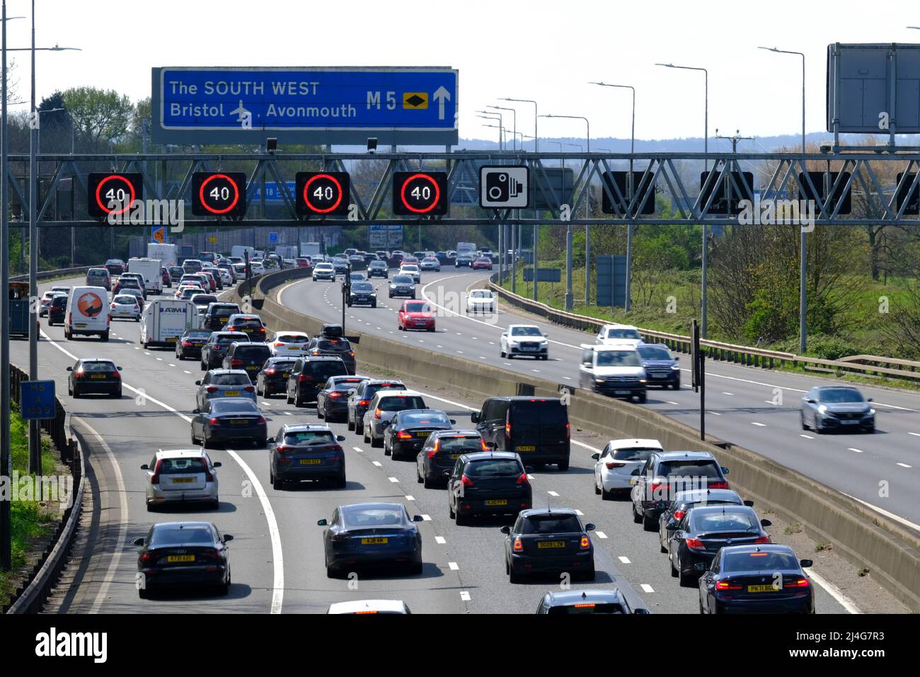 Bristol, UK. 15th Apr, 2022. Traditional Easter Holiday congestion on the M5 motorway. Staycationer's head south for the Easter Bank Holiday. Speed restrictions are in place on the managed section of the M5 motorway at Filton due to the volume of traffic heading south towards Devon and Cornwall. Credit: JMF News/Alamy Live News Stock Photo