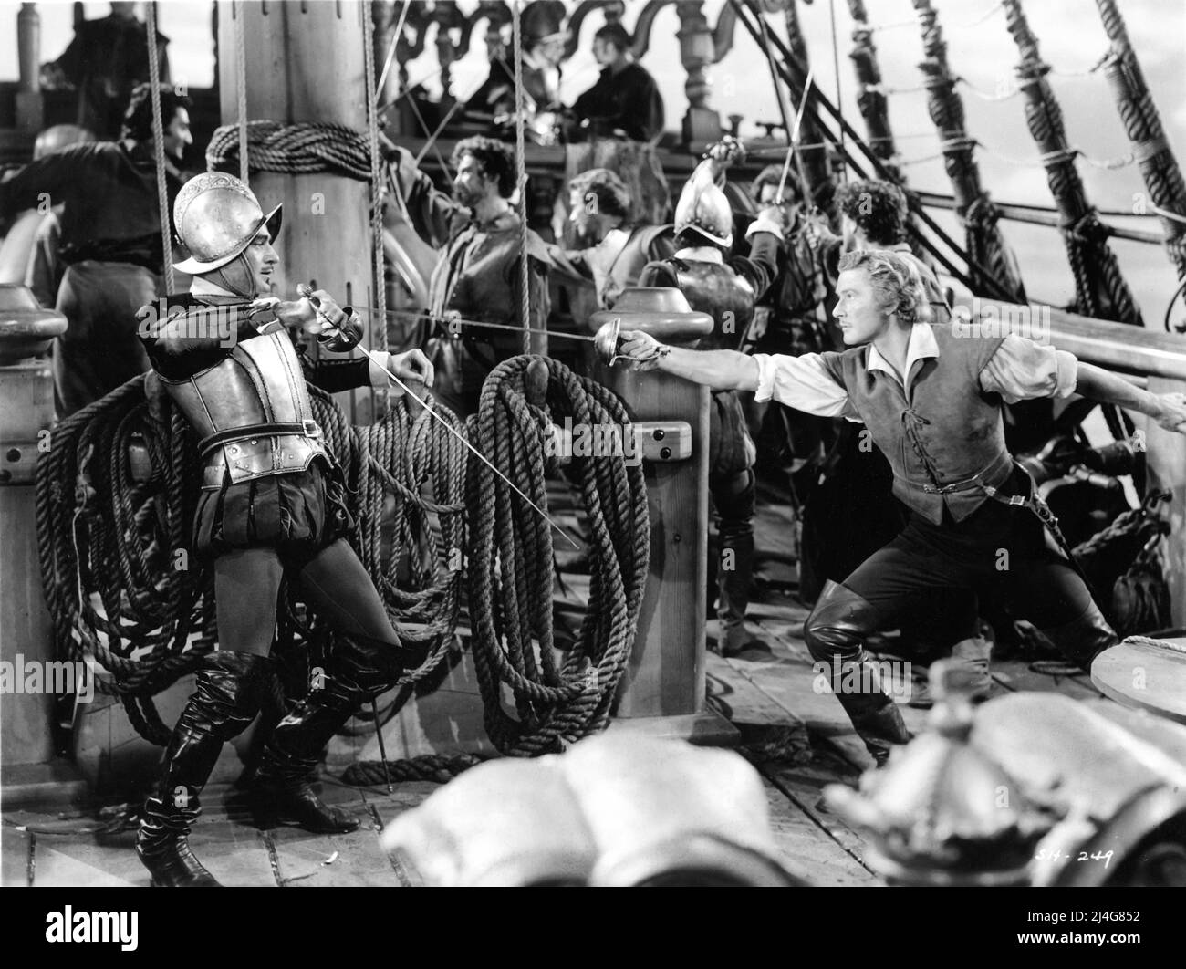 GILBERT ROLAND and ERROL FLYNN in THE SEA HAWK 1940 director MICHAEL CURTIZ writers Howard Koch and Seton I. Miller costumes Orry-Kelly music Erich Wolfgang Korngold Warner Bros. Stock Photo