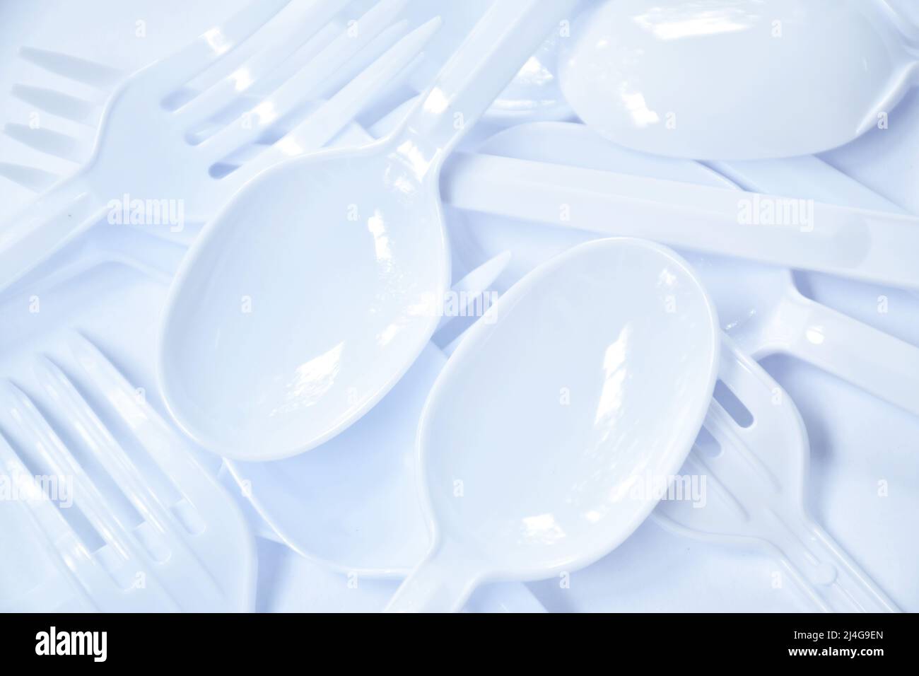 plastic spoon and fork for single used arranging on white background Stock Photo