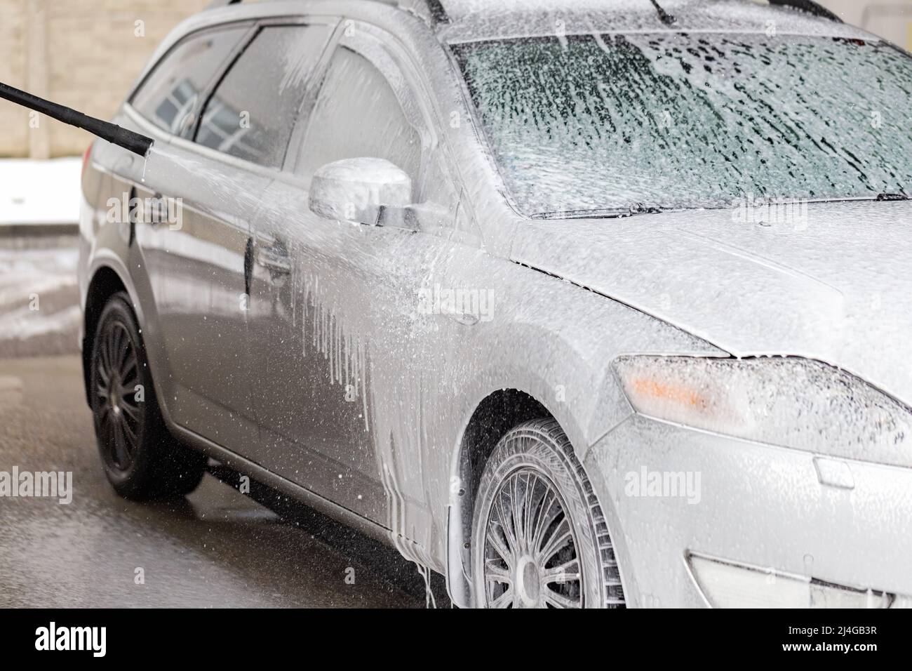 Modern vehicle cleaning with high pressure in carwash Stock Photo