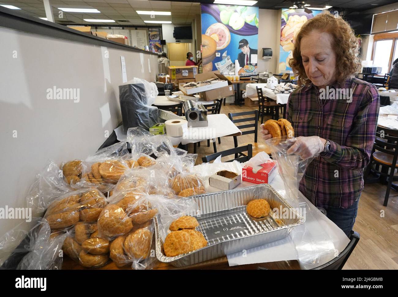 Creve Coeur, United States. 15th Apr, 2022. Worker Cheryl Waldman bags bulkas, an unleven bread for Passover, at Kohn's Deli in Creve Coeur, Missouri on Thursday, April 14, 2022. Passover, which begins on April 17, 2022 is a major Jewish holiday that celebrates the exodus of the Israelites from slavery in Egypt. Photo by Bill Greenblatt/UPI Credit: UPI/Alamy Live News Stock Photo