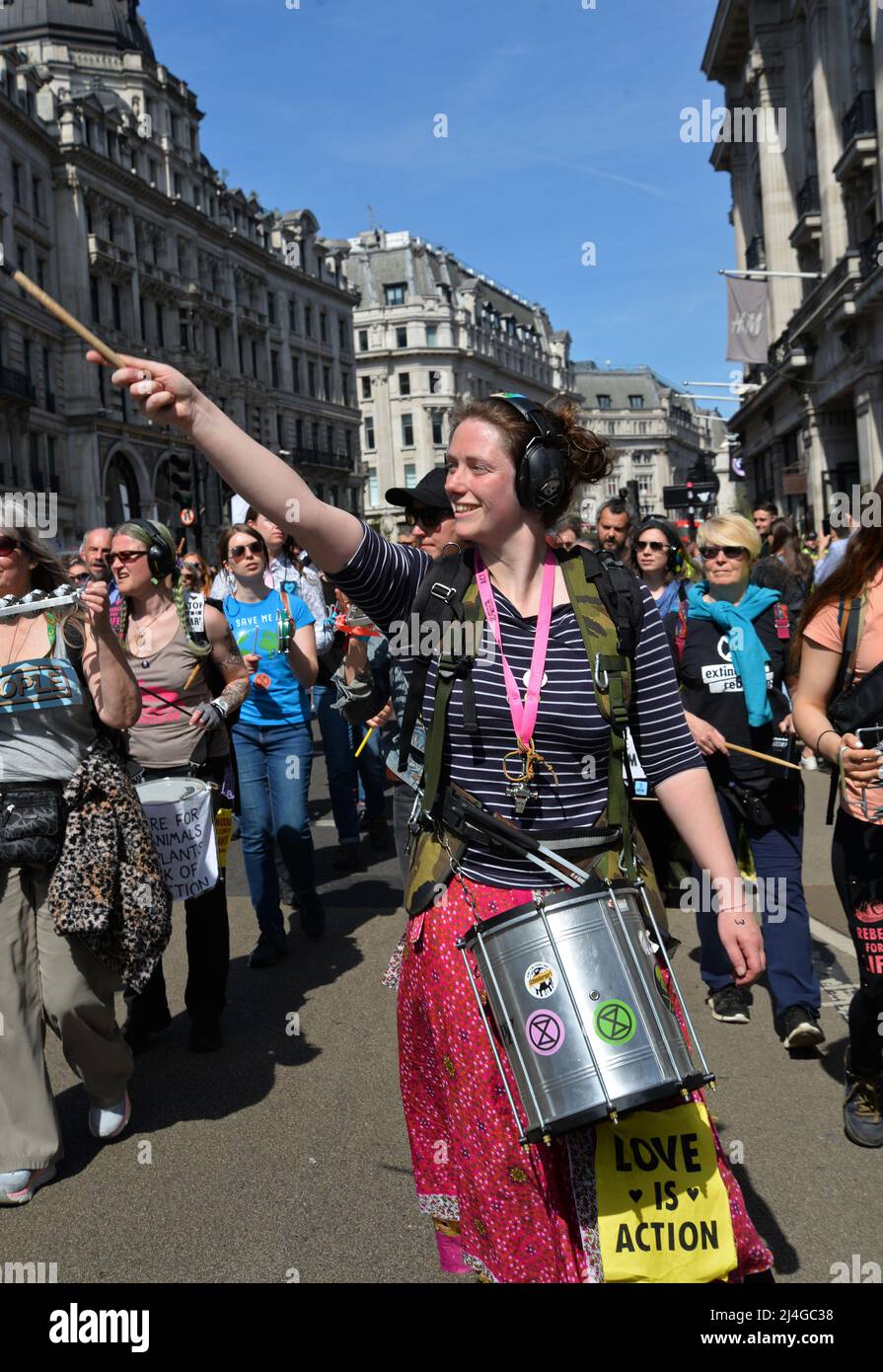 Regent Street, London, UK. 15th Apr 2022. London, UK. 15th Apr, 2022. XR Climate change protester marches down Regent St on a sunny Good Friday afternoon, 15th April 2022. Credit: Mark York/Alamy Live News Stock Photo