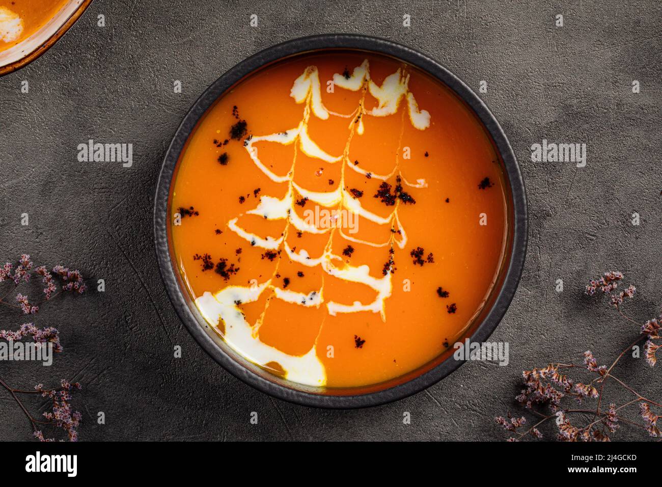 Pumpkin cream soup with cream Stock Photo