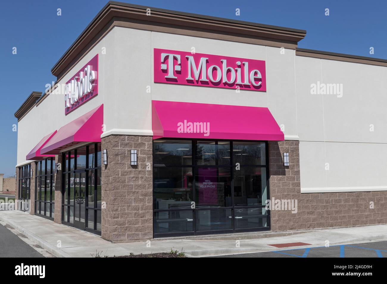 Logansport - Circa April 2022: T-Mobile cell and mobile phone store. T-Mobile merged with Sprint to create a larger 5G internet and communications net Stock Photo