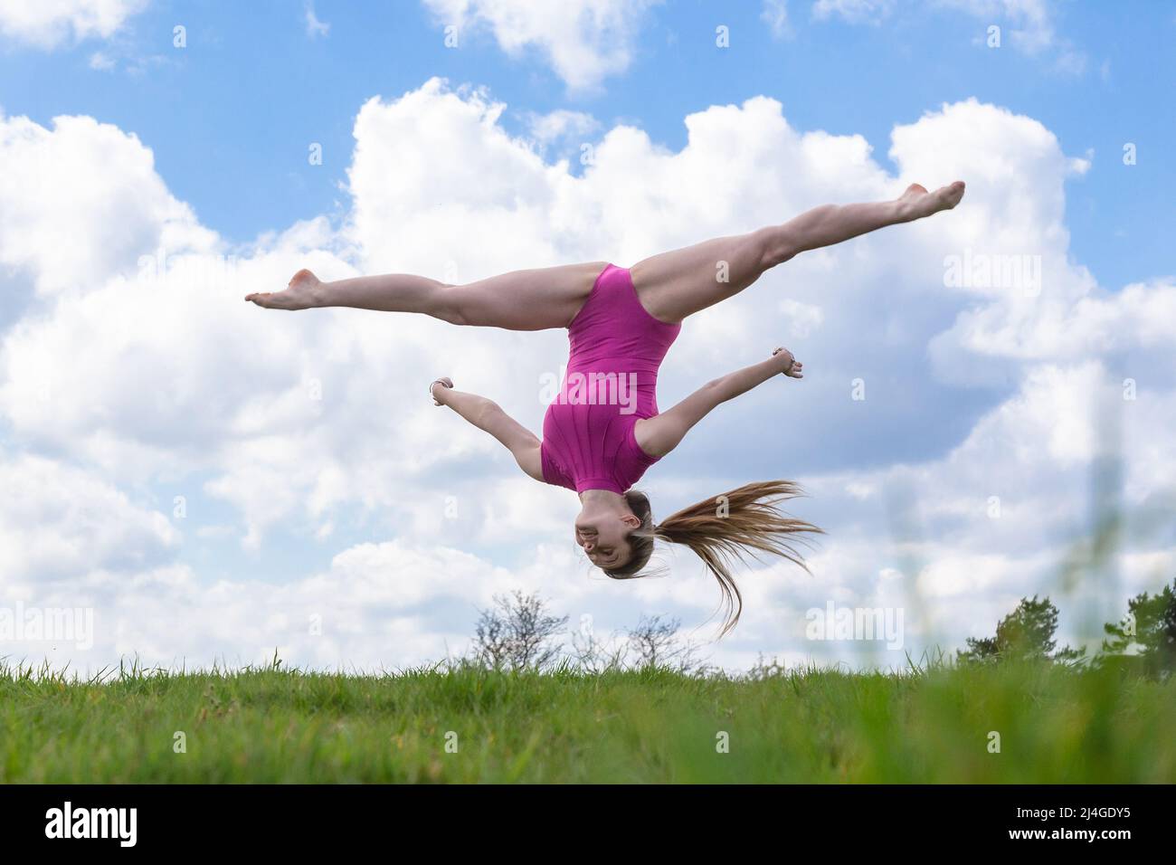 Birmingham, UK. 15th Apr, 2022. 17-year-old dance student Amelia Hubbard of Halesowen, West Midlands, takes to the park in south Birmingham to do some spring moves, as temperatures soar in the UK on Good Friday. Credit: Peter Lopeman/Alamy Live News Stock Photo