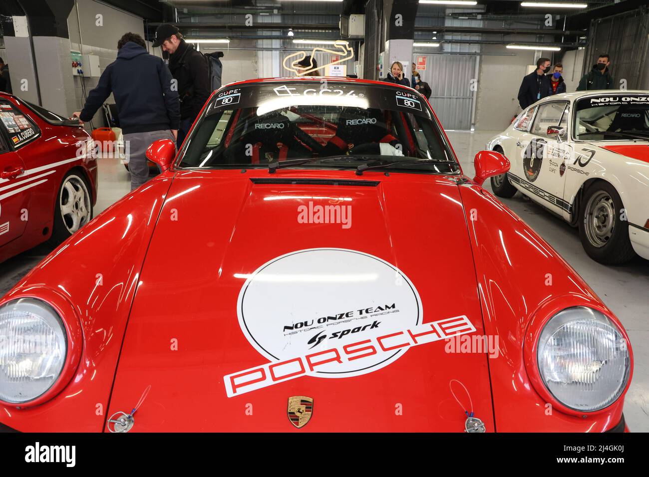 Porsche 911 race car in team garage at Espiritu de Montjuic historic race event at Circuit de Catalonia in Barcelona, Spain on 3/4/22 Stock Photo