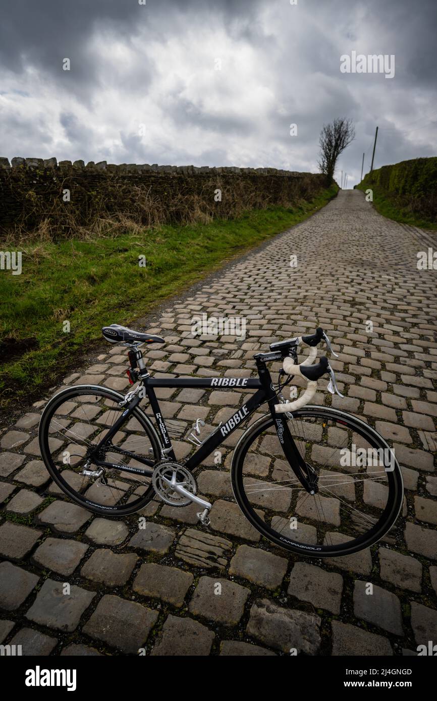 Ribble Cycles road bike on a cobbled road, Lancashire, UK. Stock Photo