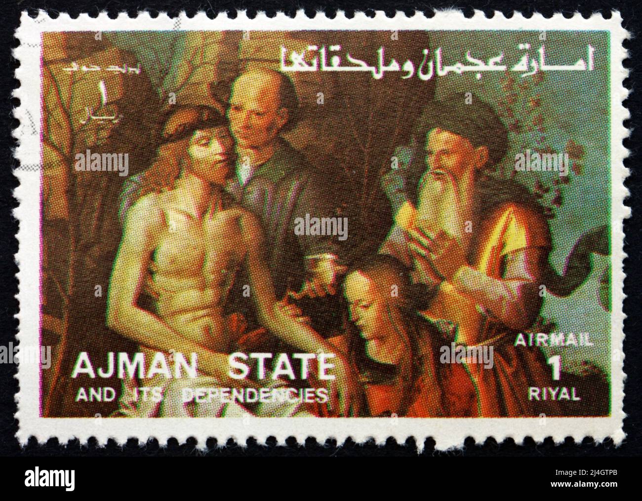 AJMAN - CIRCA 1973: a stamp printed in the Ajman shows The Descent from the Cross, Life of Jesus, circa 1973 Stock Photo