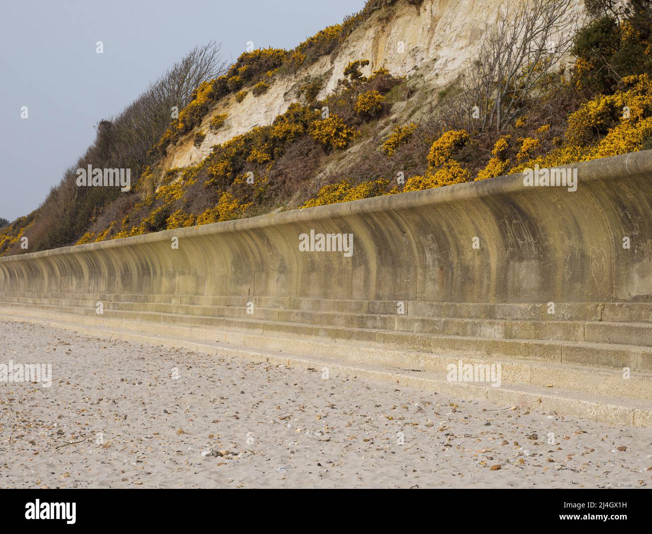 Friars cliff concrete wave wall, sea defence, Avon beach, Christchurch, Dorset, UK Stock Photo