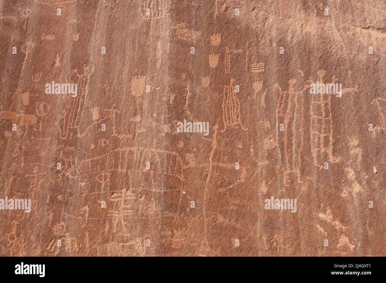 Petroglyph rock art on sandstone cliffs near Neon Canyon, Glen Canyon National Recreation Area, Garfield County, Utah, USA Stock Photo