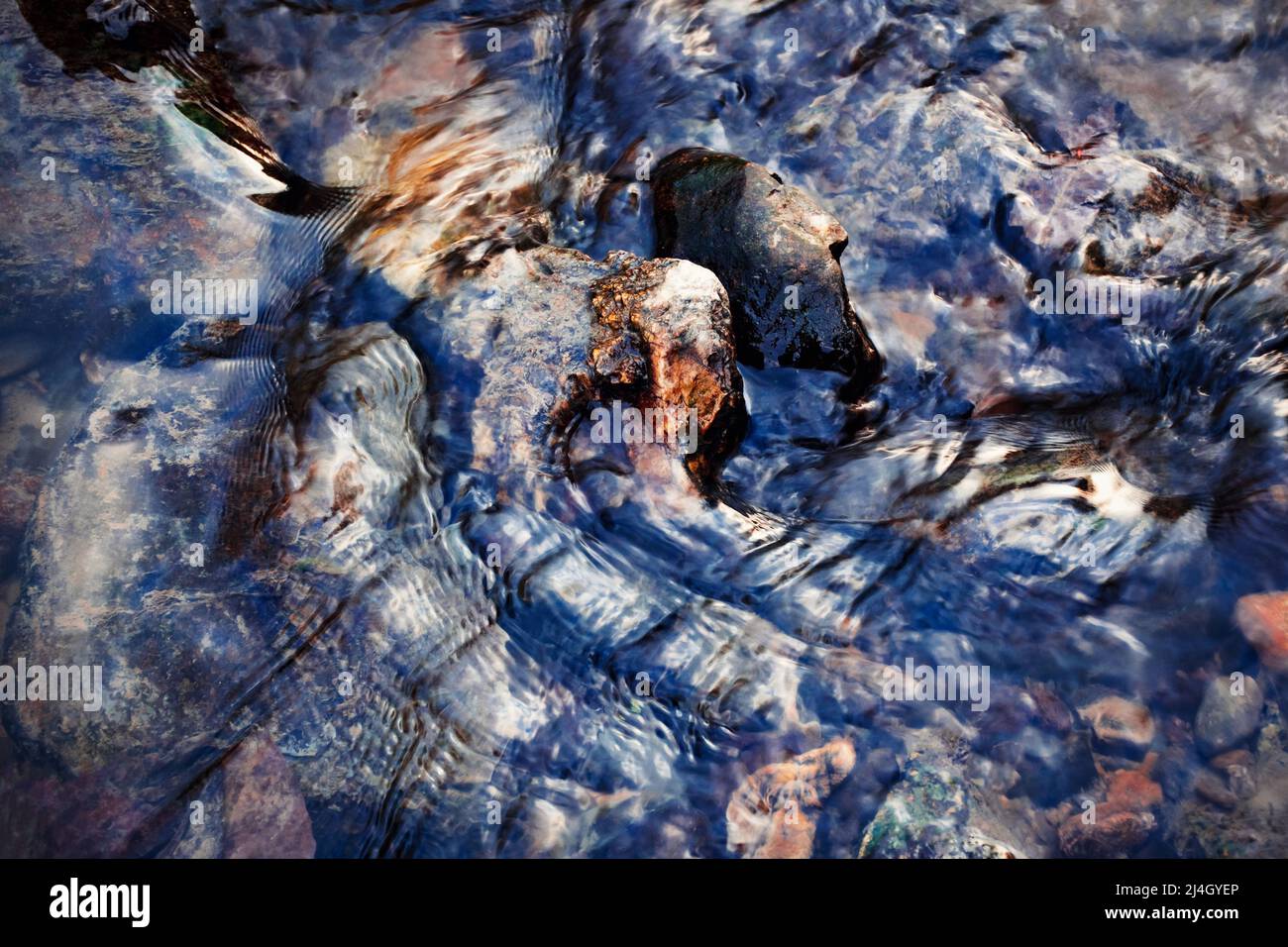seasonal background pebbles lying in the river Stock Photo - Alamy