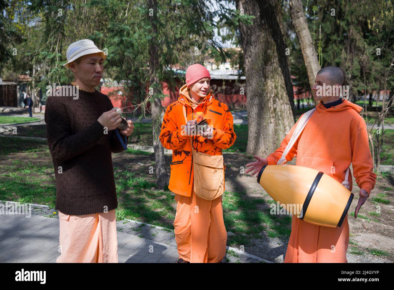 Vladikavkaz , Russia - 15 April , 2022 : members of Hare Krishna chanting and dancing Stock Photo