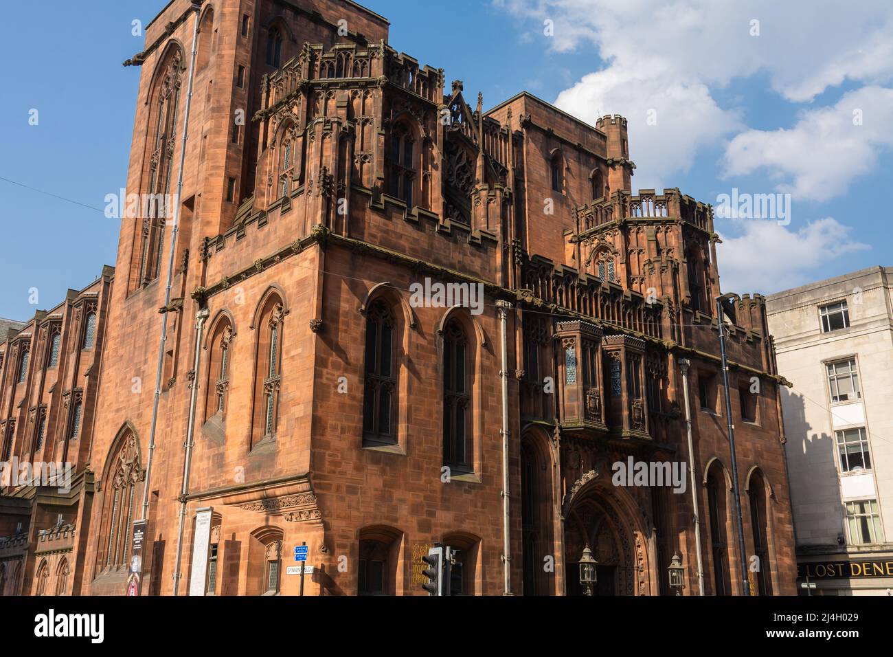 Manchester, England - United Kingdom - March 23rd, 2022: Exterior of the John Rylands Library, originally opened in 1899, on a beautiful afternoon. Stock Photo