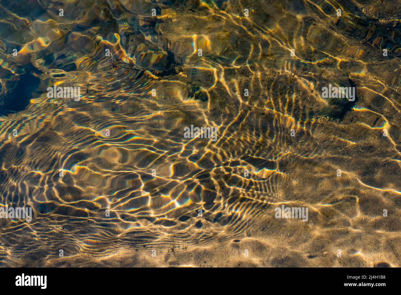 Ripples catching sunlight on the surface of Mitchell Creek, Clay Cliffs Nature Area in Big Rapids, Michigan, USA Stock Photo