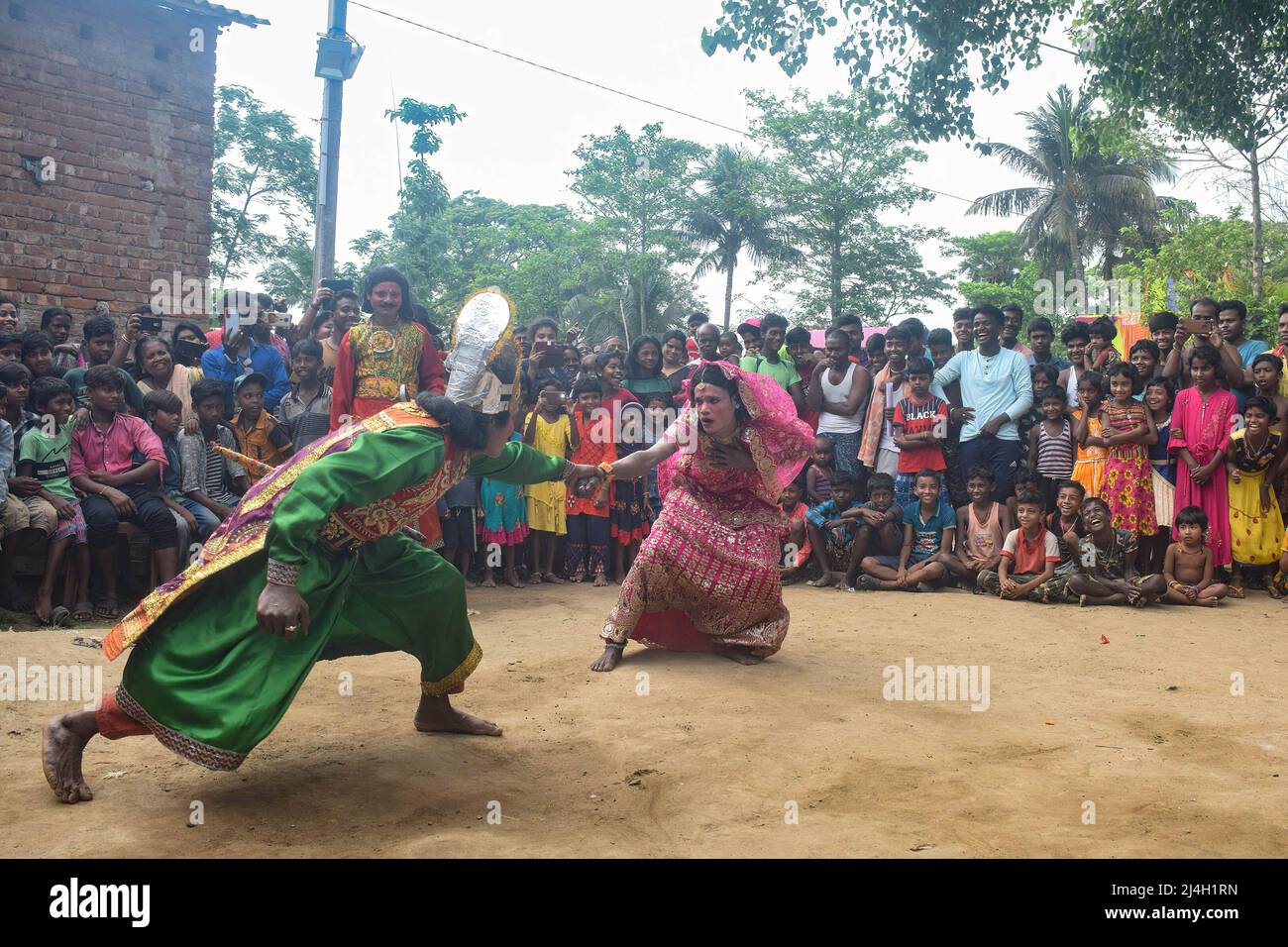 Cosplayers are seen performing during the Gajan festival at Hooghly. Gajan is a Hindu festival celebrated mostly in West Bengal as well as southern part of Bangladesh during the end of the month of ìChaitraî of the Bengali calendar followed by another festival named ìCharakî.  This festival is mainly worshipping Hindu Lord Shiva and Parvati before the start of the harvesting season.  Gajan is actually connected to the people who are related to the agricultural community, directly or indirectly. People celebrate by performing rituals such as face painting and cosplaying. Devotees dress up as Hi Stock Photo
