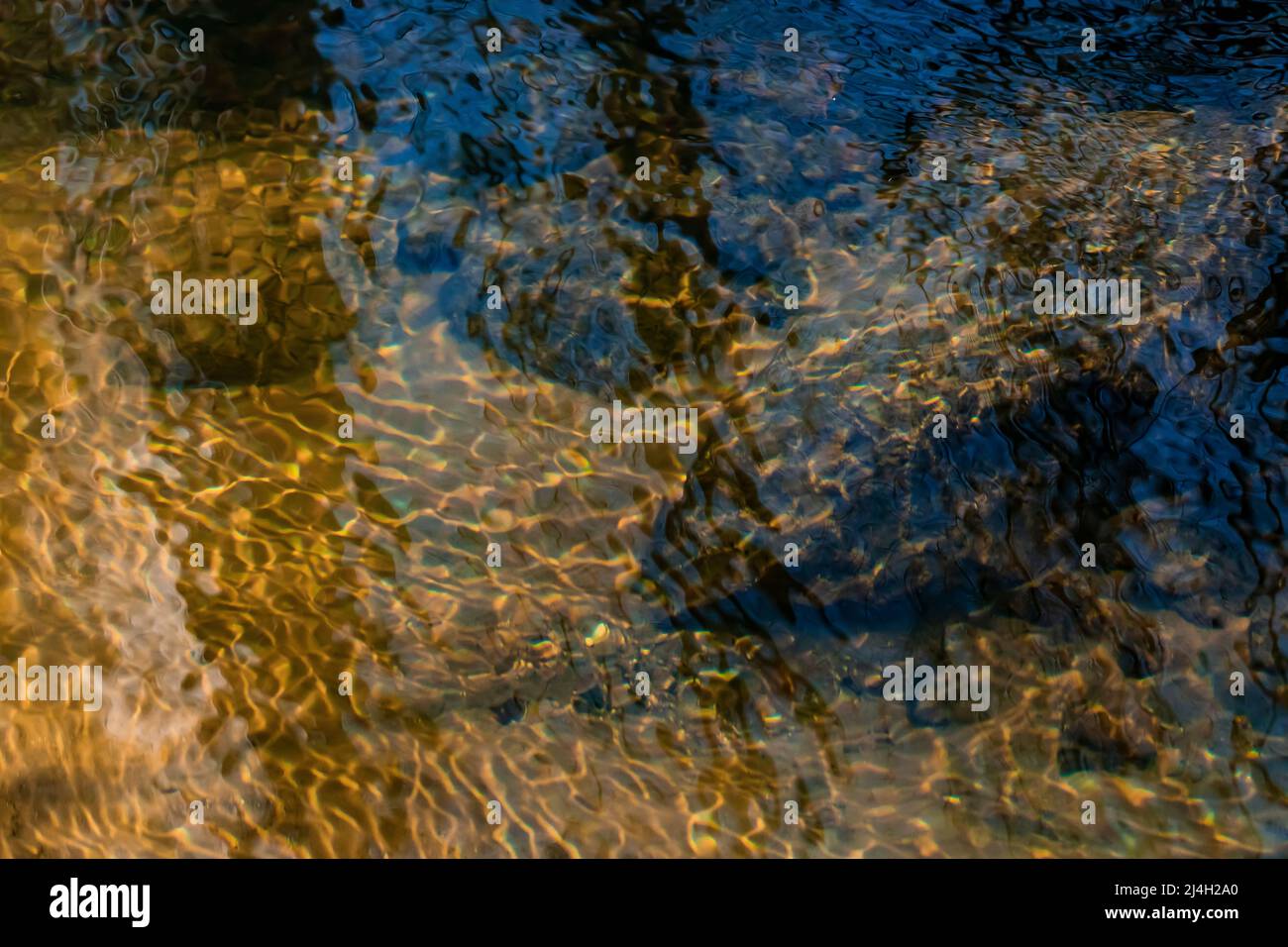 Ripples catching sunlight on the surface of Mitchell Creek, Clay Cliffs Nature Area in Big Rapids, Michigan, USA Stock Photo